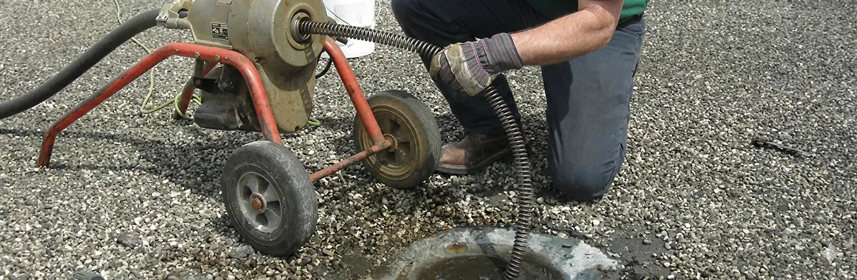 sewer rodding technician actively removing blockages from a sewer line in Wichita, KS