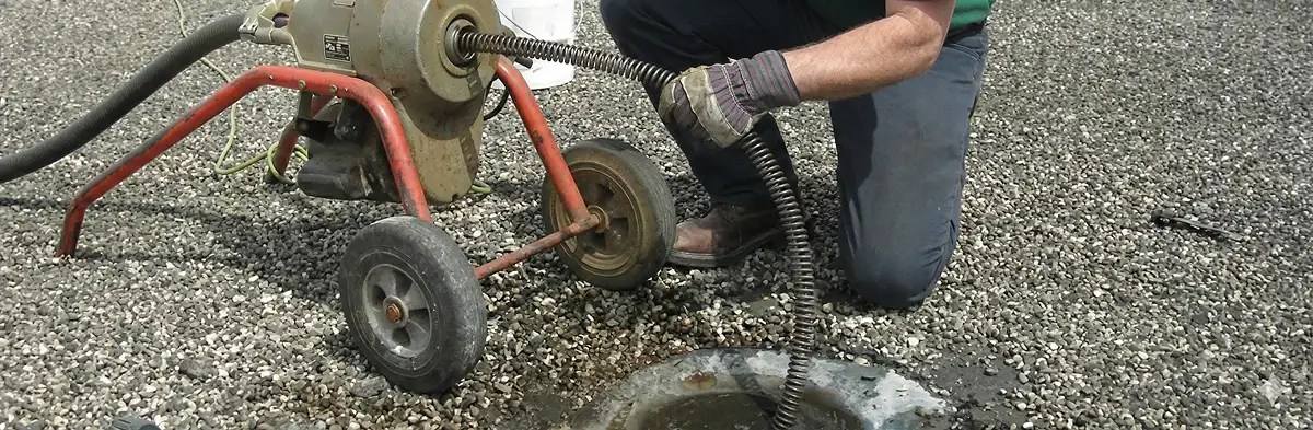 sewer rodding technician actively removing blockages from a sewer line in Wichita, KS