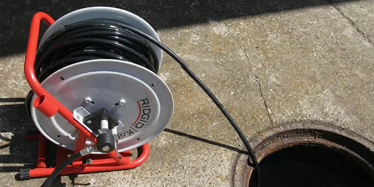 sewer rodding equipment prepared to clear clogged sewer lines in Wichita, KS