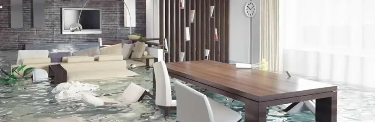 home interior affected by water damage with flooded floors and displaced furniture in Wichita, KS